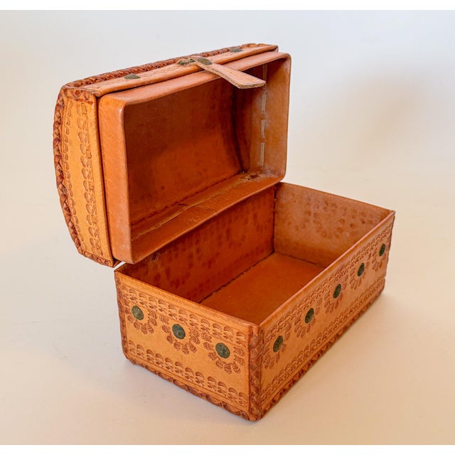 Lovely vintage Spanish style domed box made entirely of tooled embossed leather and metal studs. The box features braided...