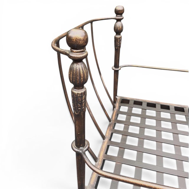 A Michael Taylor Designs armless lounge or slipper chair in bronzed cash aluminum iron from the iconic Montecito...