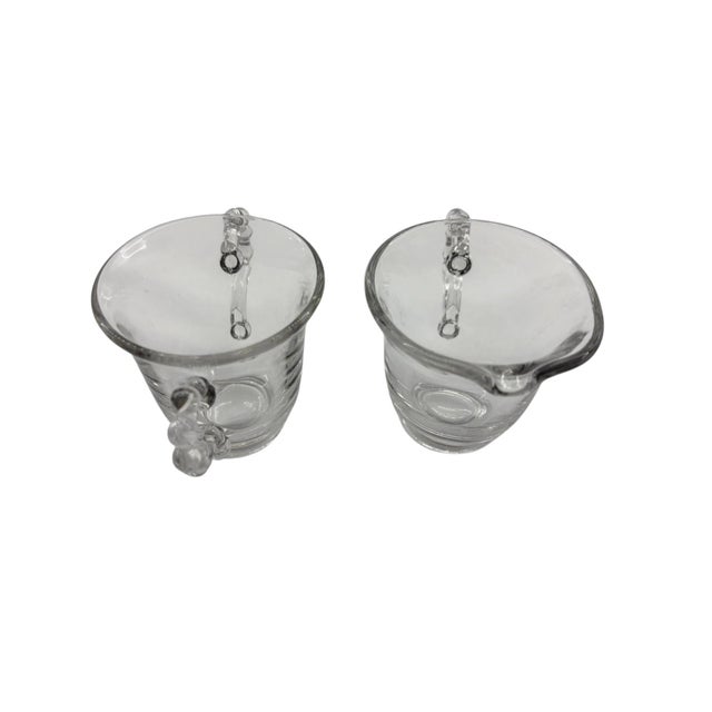 This creamer and sugar set is manufactured by Imperial Glass. Each piece is handcrafted, so measurements can vary...