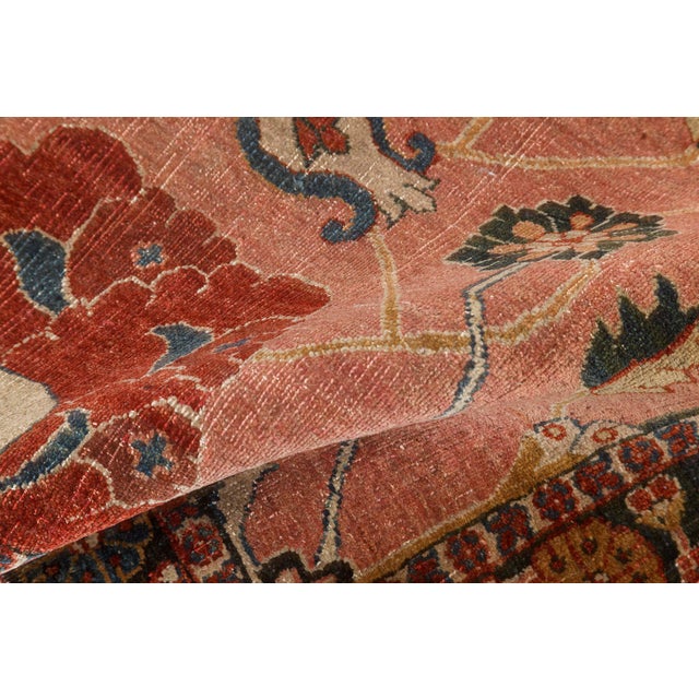 This captivating antique Persian Tabriz rug from the 1920s is a testament to the enduring legacy of one of Irans most...