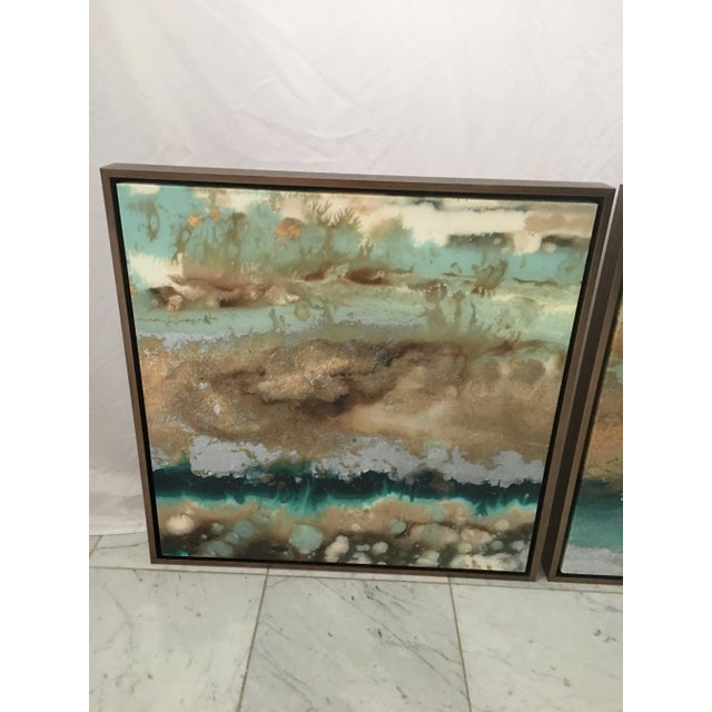 Contemporary pair of colorful framed giclee’s measuring 25” x 24” x 2” . Purchased for a model that sold before they could...