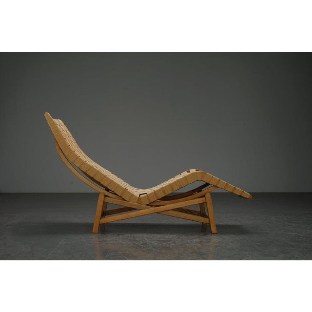 period: 1960s origin: Denmark dimensions: h62-87 x w53 x d162 cm material: wood, original fabric straps I have official...