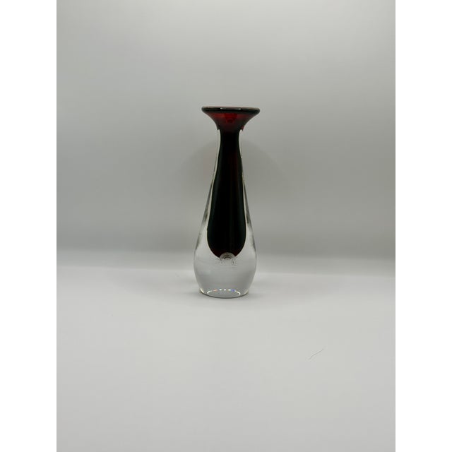 Please read the entire description. A striking vintage Orrefors glass vase with a clear sculptural body, rich ruby red...