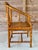 A beautifully crafted vintage Chinoiserie horseshoe side chair featuring a richly detailed tortoise faux bamboo finish,...
