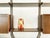 This bookcase was produced in Italy around the 1960s. It consists of 2 main wooden units with shelves and containers,...