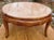 This solidly constructed 1954 coffee table is unusual for having an inset marble top. The warm finish of the fruitwood...