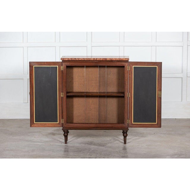 circa 1820 19thC English Regency pine cabinet Later marble top over two panelled doors with panels painted to resemble...