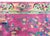 A beautiful early 20th century Chinese Art Deco rug with a mauve central field covered in myriad auspicious flowers...