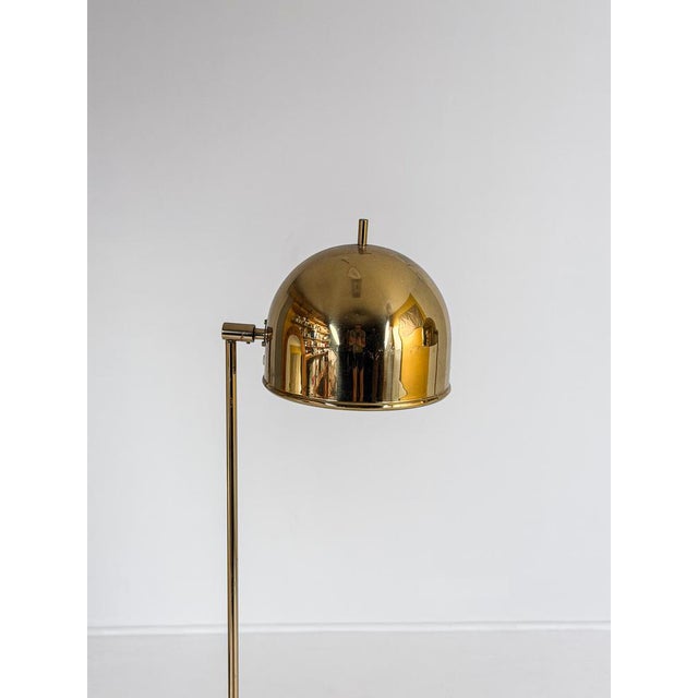 A striking pair of floor lamps, model g-075, designed by eje ahlgren and produced by bergboms in sweden during the 1960s....