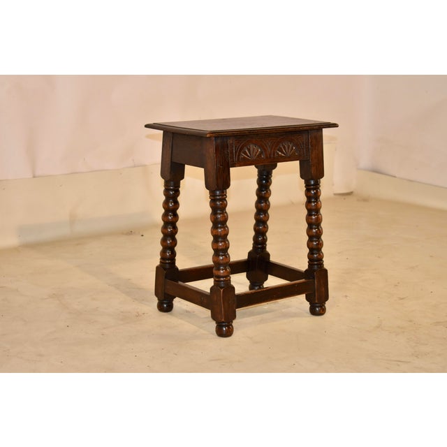 19th century hand carved oak joint stool from England. The top has a nicely beveled edge, following down to a hand-carved...