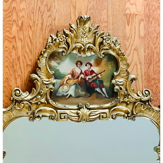 Vintage Rococo mirror, with its painted pastoral scene at the crest, exemplifies the Rococo aesthetic, possibly with later...