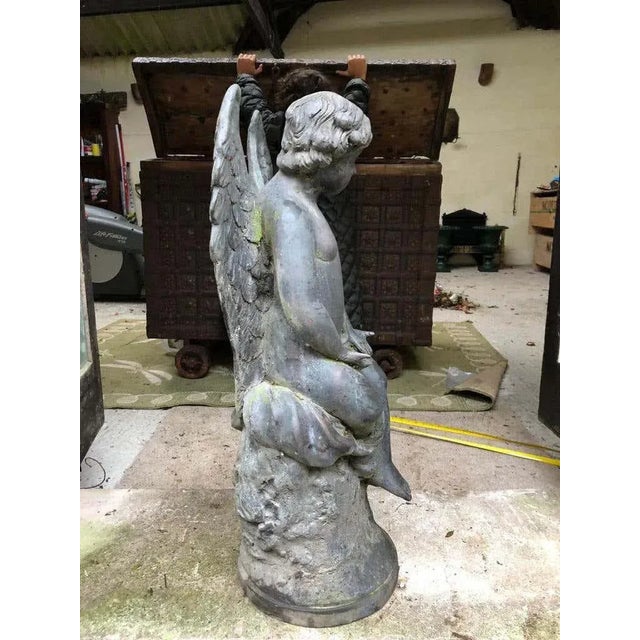A beautiful 19th century large bronze angel with wonderfully aged patina. Perfect as garden furniture or home decoration....
