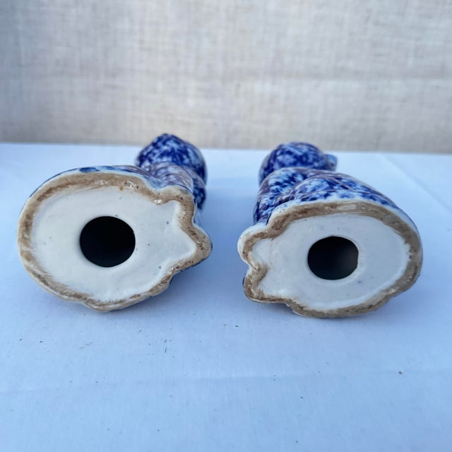 A lovely pair of blue and white chintz, calico or chinoiserie patterned figures. These could easily be filled with sand...