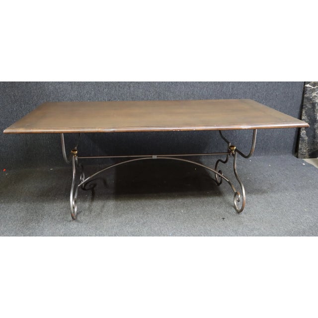 French Style Dining Table . Solid walnut top , breadboard ends , pinned construction. The base is made of polished steel ,...