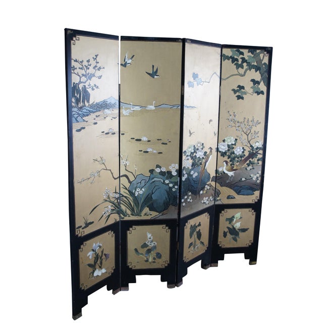 Late 20th Century Chinoiserie Four Panel Folding Screen / Room Divider. Features a black lacquer frame with a painted...