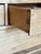 A beautiful French provincial pine armoire with paneled doors, carved architectural detailing and a wonderfully warm,...