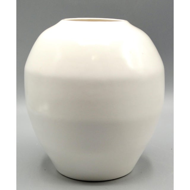 Fine quality antique creamy white undecorated faience bulbous Delft jar or vase. It is early 20th-Century in age and has...