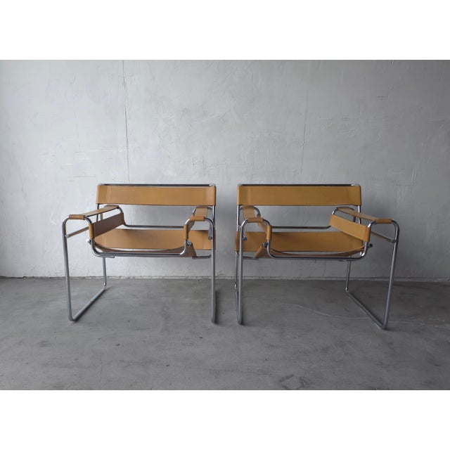All original, Vintage pair of Wassily chairs by Marcel Breuer for Knoll. Originally designed in 1925, this is a truly...