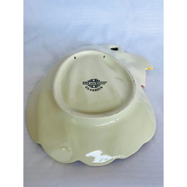 Add a pop of color to your table with this Fitz & Floyd gourd dish. Great serving or decor piece.