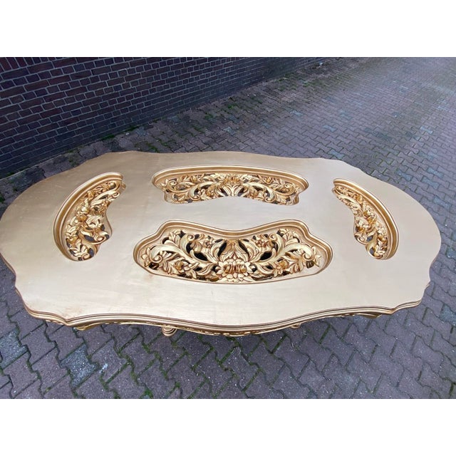 This impressive Italian dining table dates to approximately 1970 and embodies the dramatic elegance of the Baroque and...