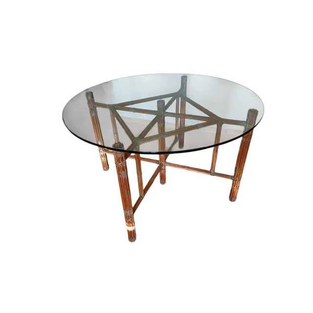 Table designed by Lyda Levi for McGuire in the 1980s. The base is made of bamboo with leather bindings, and the top is...
