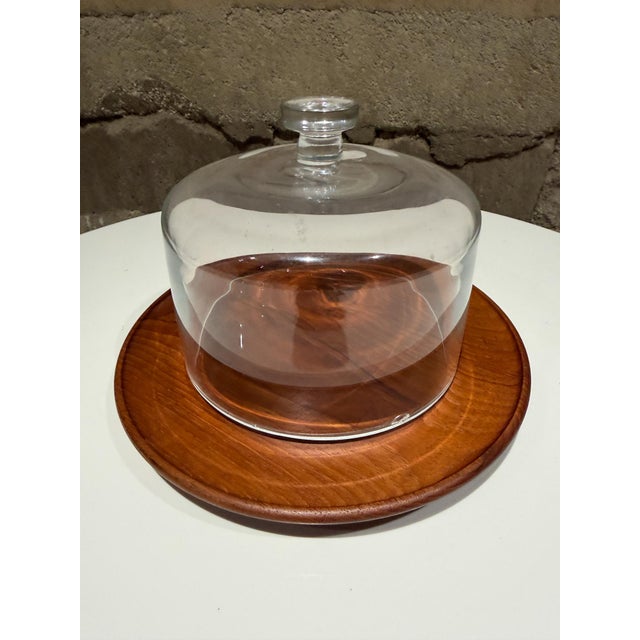 For your consideration, a vintage Mid-Century Modern cheese server or cloche featuring a solid teak wood base and a...