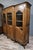 Large provençal bookcase in the louis xv style, made of oak, 20th century projected front with three paneled and glazed...