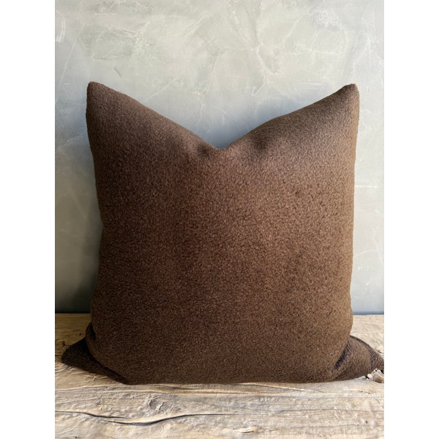 Size 20" x 20" Includes Down Feather Insert Color: Dark Brown Content: 100% Wool A luxurious pillow crafted from rich...