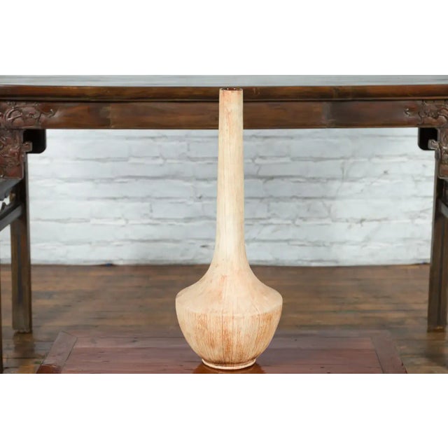 A tall contemporary Northern Thai vase from the Prem Collection, with creamy finish, dripping accents, brown glaze on the...