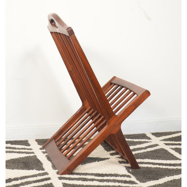 This is a beautiful 1960s magazine rack in rich, hand-rubbed solid walnut. In very good condition with some wear from use...