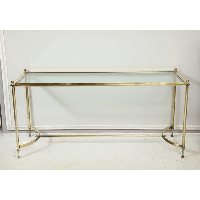 Vintage brass and chrome glass-top console table, body of the console is brass, feet are chrome.
