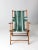 A charming mid-20th century deck chair featuring a classic wooden frame paired with bold green striped canvas upholstery....