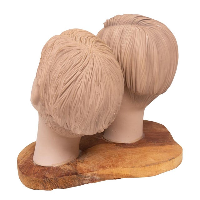 Two blue-eyed Jung boys heads. Mounted on a Wooden pedestal. 1960s mannequin. So very decorative.