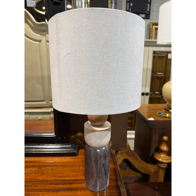 Introduce a sculptural touch of modern elegance with this Currey & Company “Moreno” table lamp, a beautifully balanced...