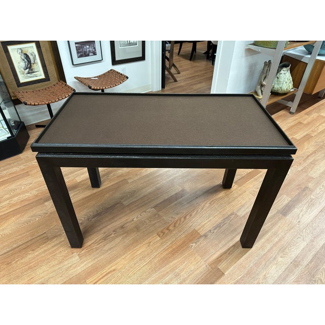A beautiful faux snakeskin leather game table with a removable top. The top is two sided and the bottom is covered in felt...