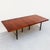 Exceptional and rare 1950s expandable rosewood dining table with lacquered mahogany legs by Harvey Probber, restored to...