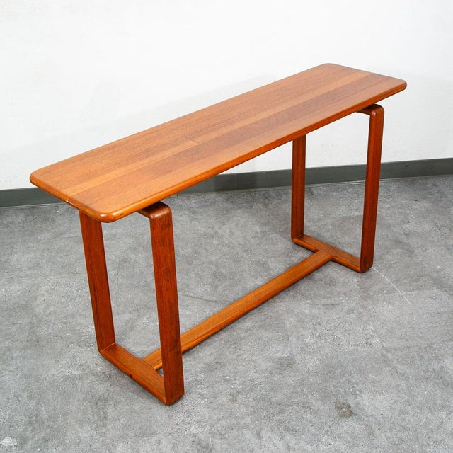 Danish designed solid teak console table. Extremely well made. Great piece for behind the sofa or as an entryway table....