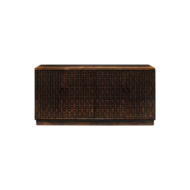 Made with reclaimed pine, this four door credenza has an intricate carved geometric pattern to the doors, in a vintage...