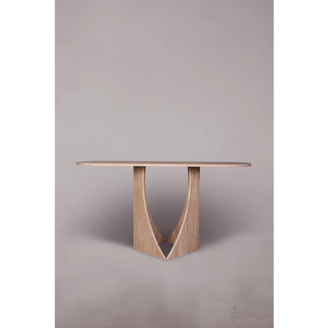 Introducing our exquisite Travertine Console Table featuring legs reminiscent of penguin feet. Crafted with precision and...