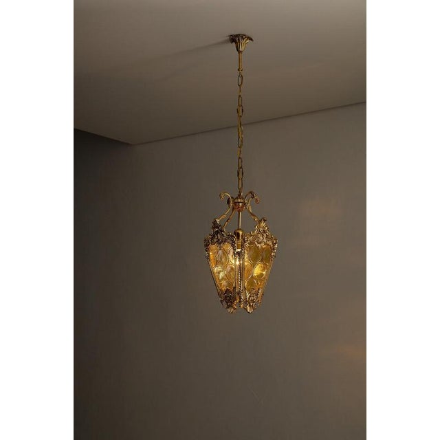 Ornate pendant lantern dates from the mid-20th century designed in the Rococo (Late Baroque) style. The fixture features a...