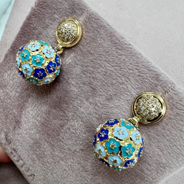 Created in 18 karat yellow gold Multi color enamel details Diamonds 0.80 carats approx. 18kyg butterfly backs Limited...