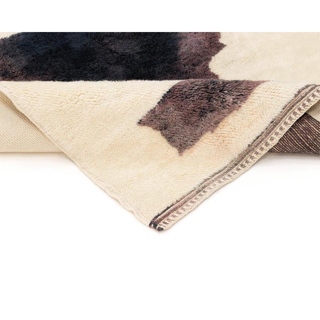 Exquisite hand-knotted wool rug with bold Espresso silhouettes on an Ivory canvas, creating a sophisticated focal point in...