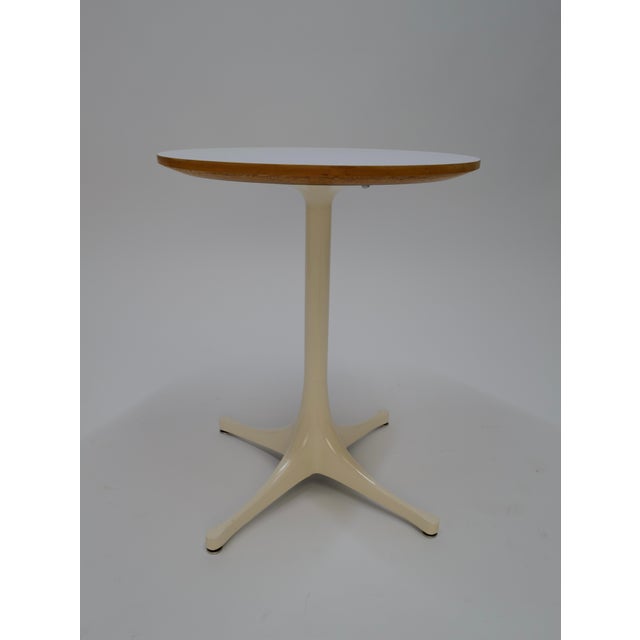 The George Nelson-designed round pedestal side table for Herman Miller features a timeless and sleek design. Crafted with...