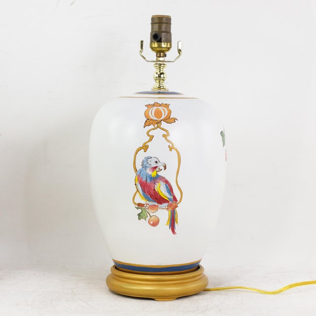 This vibrant pair of vintage table lamps features a playful, hand-painted Chinoiserie design of tropical parrots set...