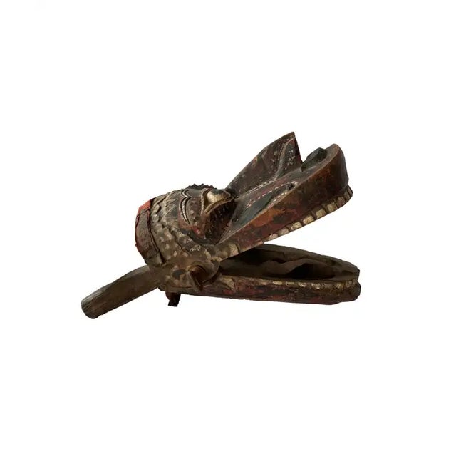 This mask from Java depicts a mythical creature which would have been used in ‘Wayang Topeng’ dance performances. It...