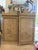 Elegant secretary in a distressed cream finish with hand decorated chinoiserie scenes, a fall front writing surface, upper...