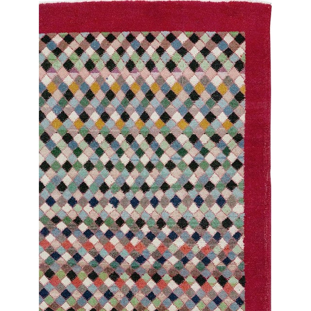 This Mid-20th century Turkish Anatolian room-size carpet presents a lively allover composition built from countless small...