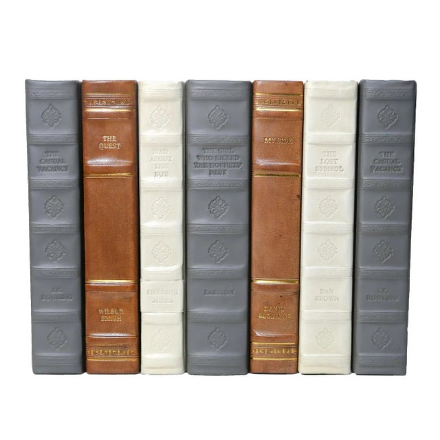 One linear foot of rebound leather books (7-9 books) from E. Lawrence. All books are published between 1980 to current....