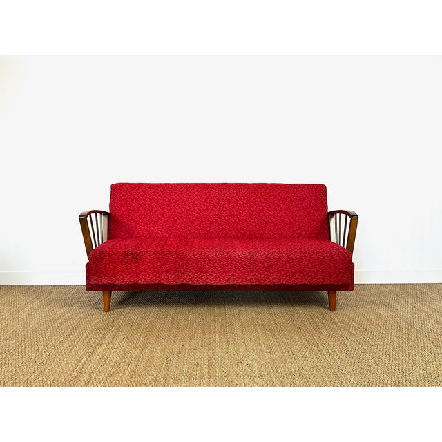 Stunning vintage sofa bed with a scandinavian design typical of the 1950s/60s. solid wood frame with slender spindle...