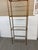 Design Plus Gallery presents a Brass Etagere with a Peaked Top and Geometric Pattern. The simple shelving unit has brass...
